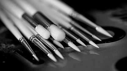 Set of Ghost paintbrushes on a dark surface
